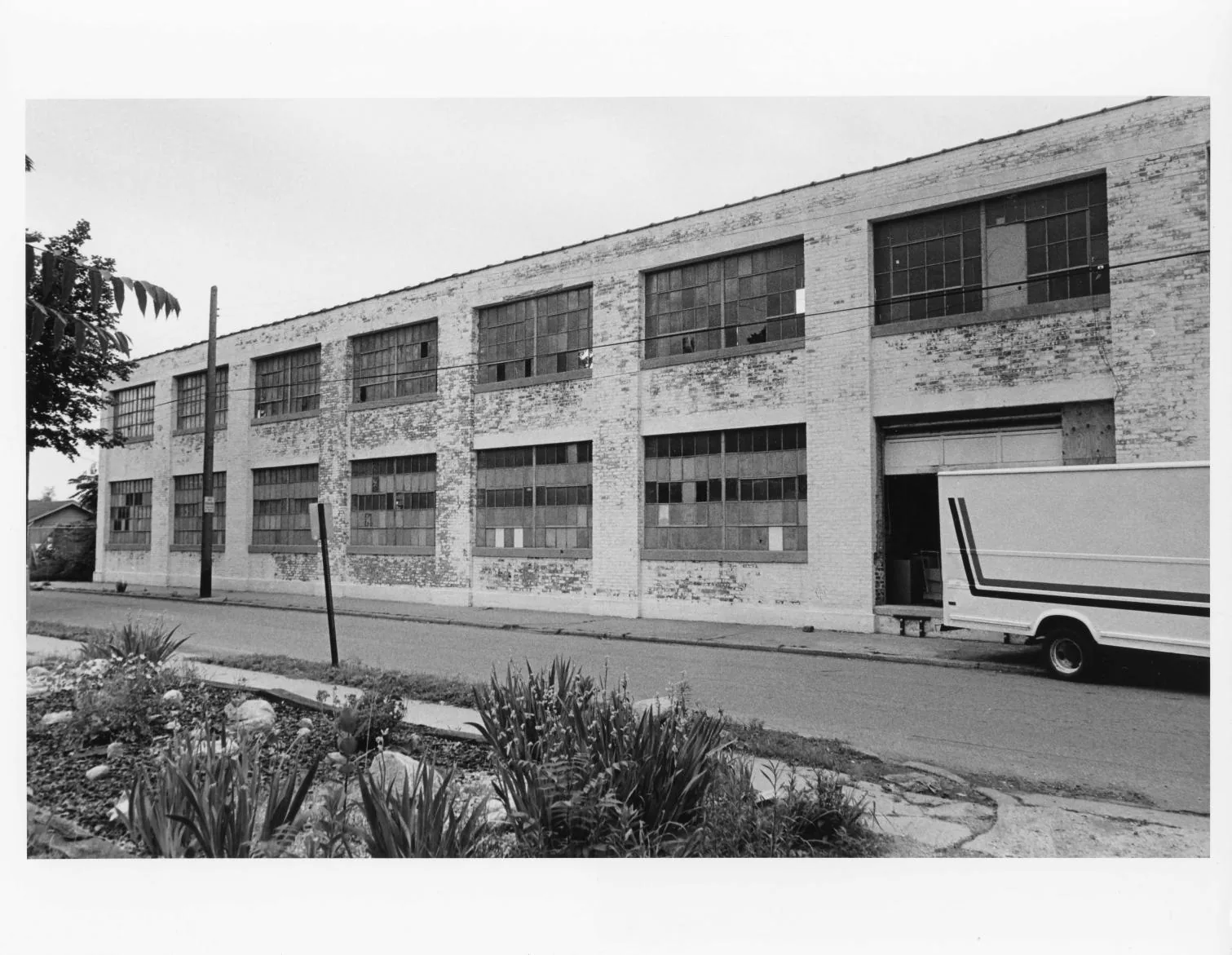 Black-and-white photographs of the Buescher Band Instrument Company Building, 1986: East Elevation Windows (1986)
