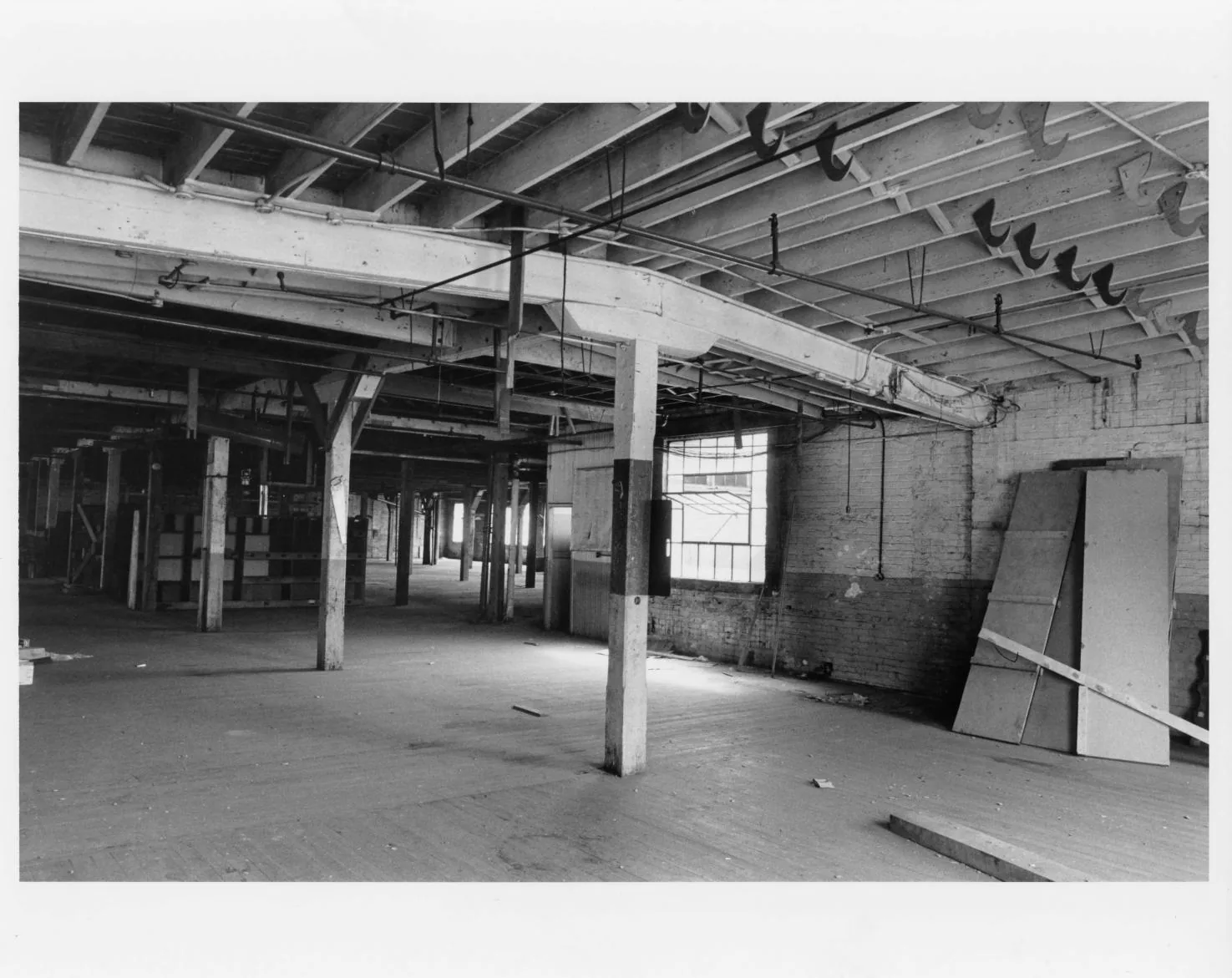 Black-and-white photographs of the Buescher Band Instrument Company Building, 1986: Interior Factory Floor (1986)
